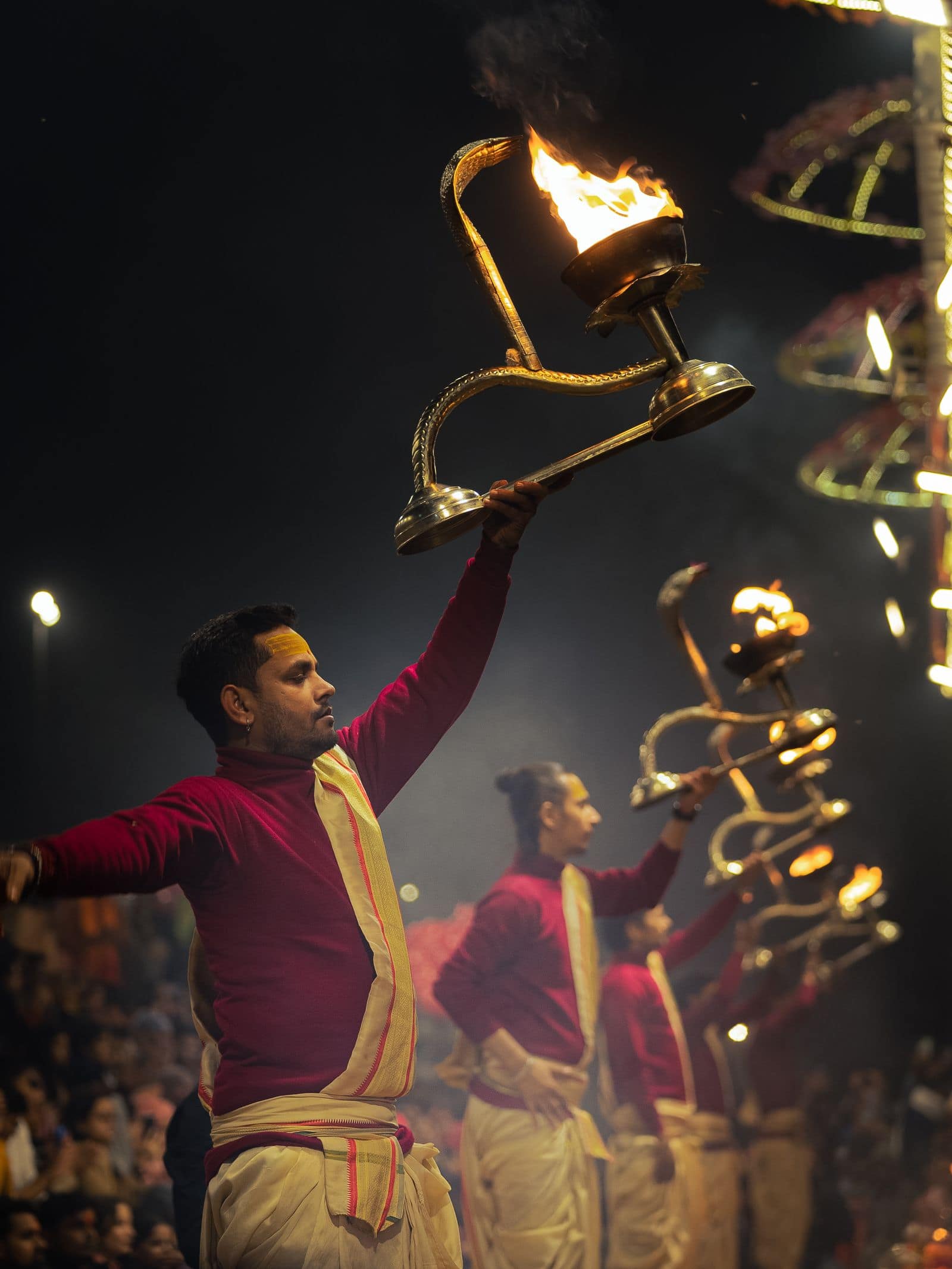 The ghats of Kashi at dusk, lit by the Ganga aarti