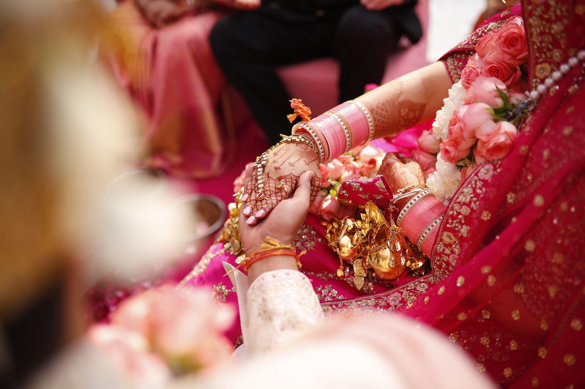 A close-up of a colourful traditional Indian wedding outfit